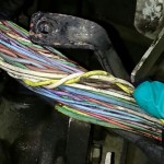 Electrical fault diagnosed: frayed wires shorting-out and interfering with ECU